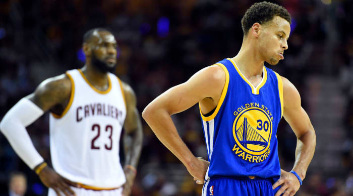 Cavs forward LeBron James and Warriors guard Stephen Curry compete in the 2015 NBA Finals.